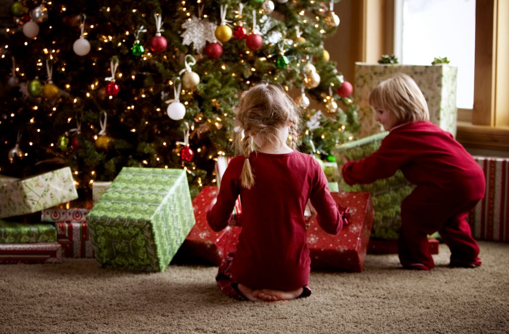 Kids Opening Gifts In Living Room